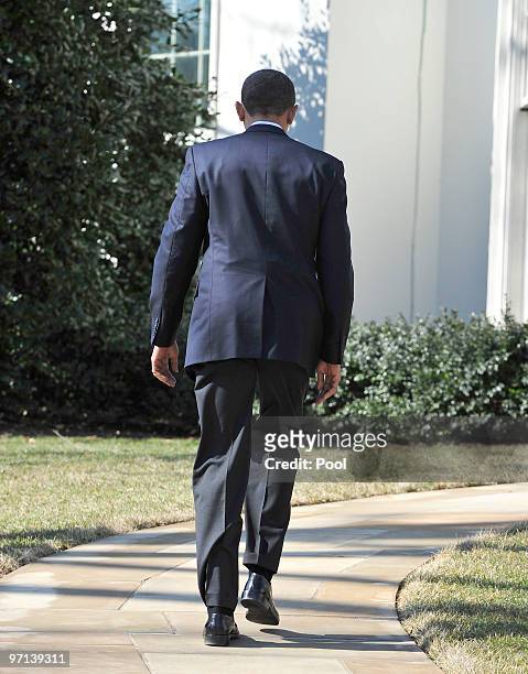 President Barack Obama returns to the Oval Office after addressing the media on the recent earthquake in Chile and a potentially damaging tsunami in...