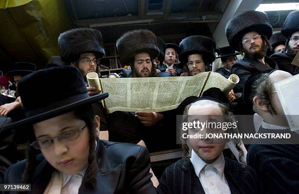 Ultra-Orthodox Jews belonging to the Vishnitz Hassidic sect read the Esther scrolls at a synagogue in the Israeli town of Bnei Brak, near Tel Aviv on...