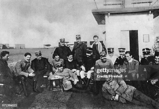 Pioneers of Italian aviation. At the Campo di Aviano 1912. Standing: lieutenant Del Giudice. Captain Capuzzo and lieutenant A. Gallotti. Sitting on...