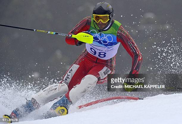 Morocco's Samir Azzimani clears a gate during the Men's Vancouver 2010 Winter Olympics Slalom event at Whistler Creek side Alpine skiing venue on...