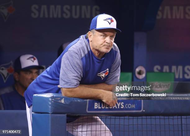 Manager John Gibbons of the Toronto Blue Jays looks on from the top step of the dugout during MLB game action against the Baltimore Orioles at Rogers...