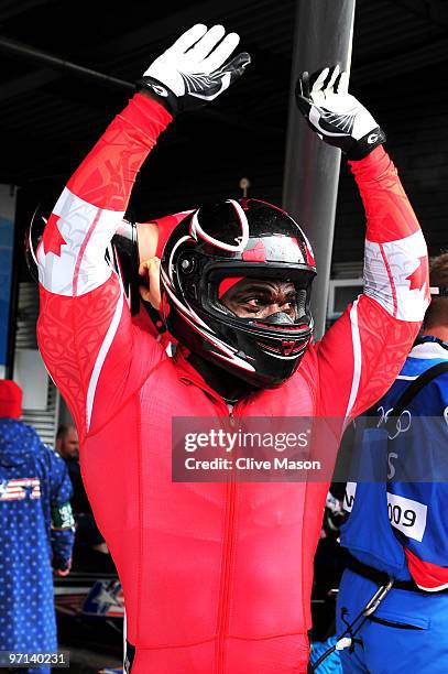 Lascelles Brown of Canada 1 celebrates after completing heat 3 during the men's four man bobsleigh on day 16 of the 2010 Vancouver Winter Olympics at...