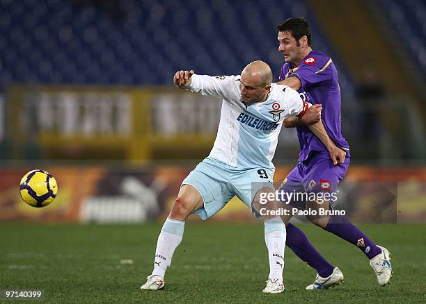 Massimo Gobbi of ACF Fiorentina and Tommaso Rocchi of SS Lazio compete for the ball during the Serie A match between Lazio and Fiorentina at Stadio...