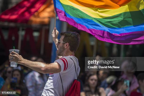 Man caries a rainbow flag during the 48th annual LA Pride Parade on June 10 in the Hollywood section of Los Angeles and West Hollywood, California....