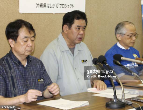 Okinawa prefecture officials hold a press conference in the capital Naha on June 11 over the end of the measles outbreak in the southernmost Japanese...