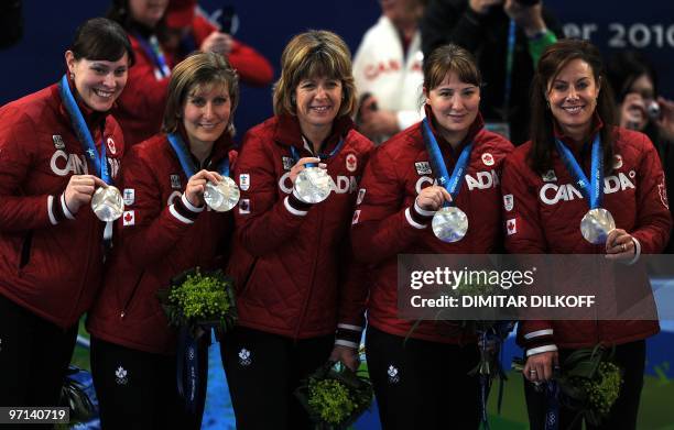 Canada's team celebrate with their silver medals after their women's curling gold medal match Canada vs Sweden games at the Vancouver Olympic Centre,...