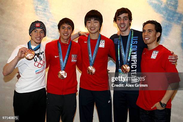 Jordan Malone, J.R. Celski, Simon Cho, Travis Jayner and Apolo Anton Ohno pose together after their bronze medal performance in the men's short track...