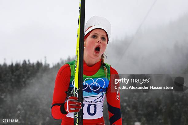Therese Johaug of Norway reacts after finishing the ladies' 30 km mass start cross-country skiing classic on day 16 of the 2010 Vancouver Winter...