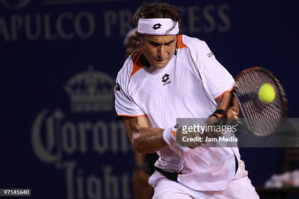 Spanish tennis player David Ferrer returns the ball to Fernando Gonzales of Chile during their match as part of the semifinals of 2010 WTA Acapulco...