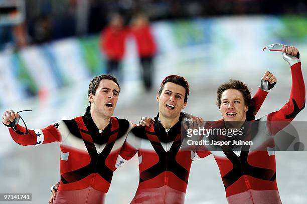 Team Canada with Mathieu Giroux , Lucas Makowsky and Denny Morrison celebrate the gold medal in the speed skating men's team pursuit finals on day 16...