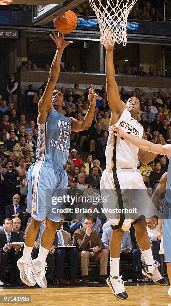 Leslie McDonald of the North Carolina Tar Heels floats a shot past David Weaver of the Wake Forest Demon Deacons on February 27, 2010 in Winston...
