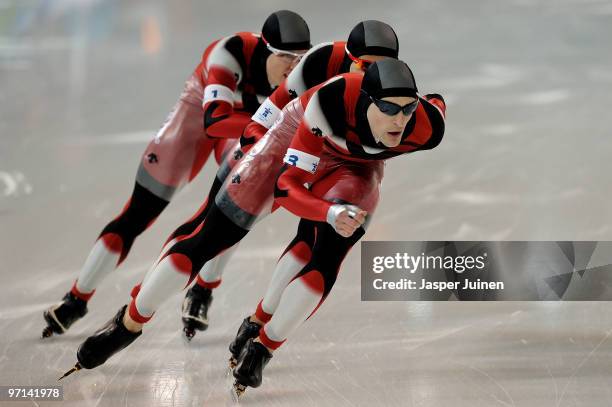 Team Canada with Mathieu Giroux, Lucas Makowsky and Denny Morrison compete on their way to winning the gold medal in the speed skating men's team...