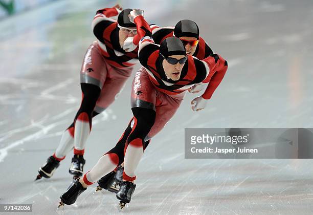 Team Canada with Mathieu Giroux, Lucas Makowsky and Denny Morrison compete on their way to winning the gold medal in the speed skating men's team...
