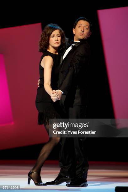 Hosts Valerie Lemercier and Gad Elmaleh perform onstage during the 35th Cesar Film Awards held at Theatre du Chatelet on February 27, 2010 in Paris,...