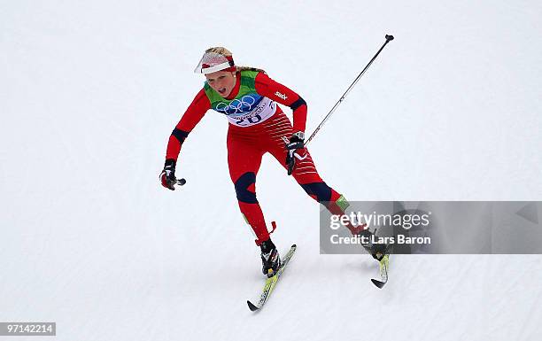 Therese Johaug of Norway competes during the ladies' 30 km mass start cross-country skiing classic on day 16 of the 2010 Vancouver Winter Olympics at...