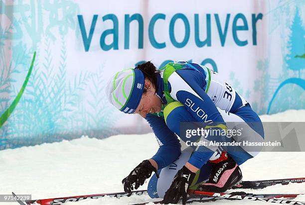 Justyna Kowalczyk of Poland reacts after the ladies' 30 km mass start cross-country skiing classic on day 16 of the 2010 Vancouver Winter Olympics at...