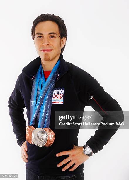 Olympic short track speed skater Apolo Anton Ohno of the United States with his two bronze medals for the men's 1000m and men's 5000m relay and...