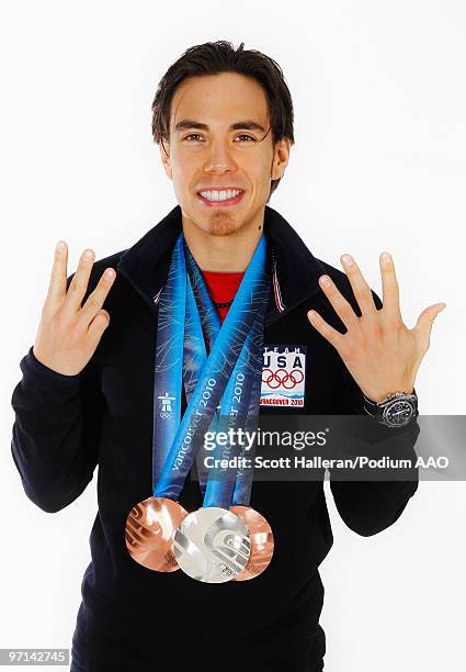 Olympic short track speed skater Apolo Anton Ohno of the United States with his two bronze medals for the men's 1000m and men's 5000m relay and...