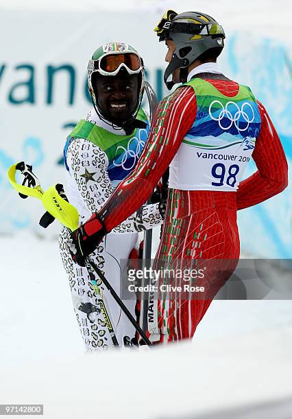 Kwame Nkrumah-Acheampong of Ghana and Samir Azzimani of Morocco reacts after the Men's Slalom second run on day 16 of the Vancouver 2010 Winter...