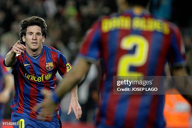 Barcelona's Argentinian forward Lionel Messi celebrates after scoring during a Spanish League football match against Malaga at the Camp Nou Stadium...