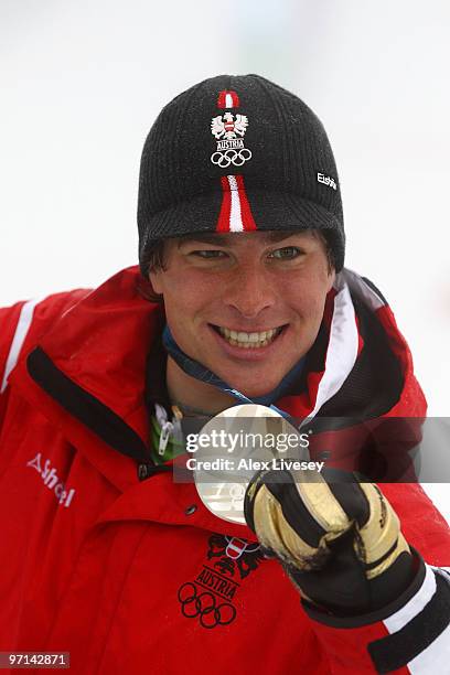 Benjamin Karl of Austria celerbates after winning the silver medal in the Snowboard Men's Parallel Giant Slalom on day 16 of the Vancouver 2010...