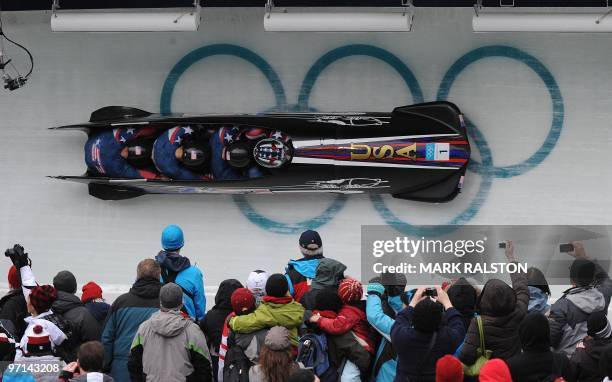 The USA-1 four-man bobsleigh team piloted by Steven Holcomb during heat 3 of the 4-man bobsleigh event at the Whistler sliding centre during the...