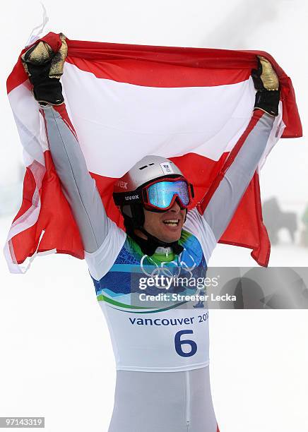 Benjamin Karl of Austria celerbates after winning the silver medal in the Snowboard Men's Parallel Giant Slalom on day 16 of the Vancouver 2010...