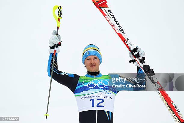 Andre Myhrer of Sweden celebrates bronze during the flower ceremony for the men's slalom alpine skiing on day 16 of the Vancouver 2010 Winter...