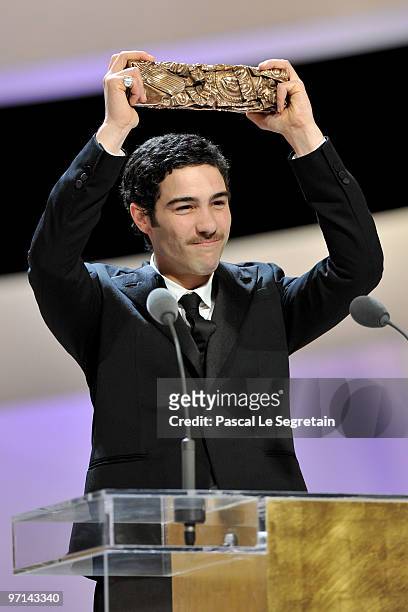 Actor Tahar Rahim reacts on stage after he received Best Male Actor Cesar Award during the 35th Cesar Film Awards at the Theatre du Chatelet on...