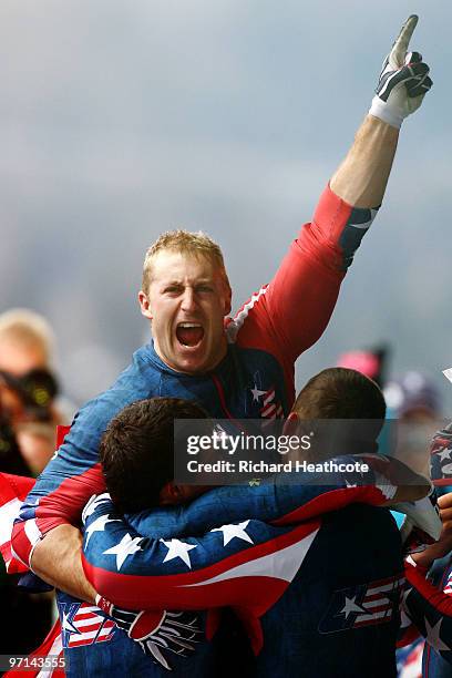 Curtis Tomasevicz of USA 1 celebrates with teammates after winning the gold medal during the men's four man bobsleigh on day 16 of the 2010 Vancouver...