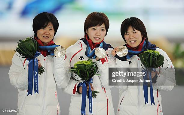 Maki Tabata, Nao Kodaira and Masako Hozumi of Japan celebrate winning the silver medal in the ladies' team pursuit final on day 16 of the 2010...