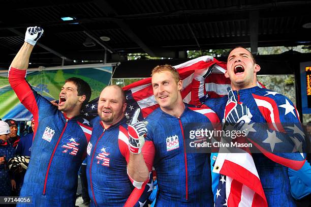 Steve Mesler, Steven Holcomb, Curtis Tomasevicz and Justin Olsen USA 1 celebrate after winning the gold medal during the men's four man bobsleigh on...