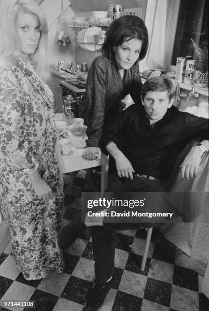 French actresses Catherine Deneuve and Yvonne Furneaux with French-Polish film director, producer, writer, and actor Roman Polanski on the set of...