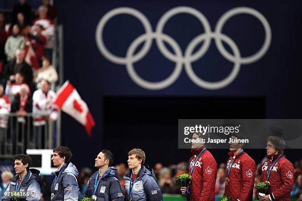 Trevor Marsicano, Jonathan Kuck, Chad Hedrick and Brian Hansen of the United States receive the silver medal and Denny Morrison, Lucas Makowsky and...