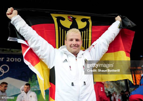 Andre Lange of Germany 1 celebrates after winning the silver medal during the men's four man bobsleigh on day 16 of the 2010 Vancouver Winter...