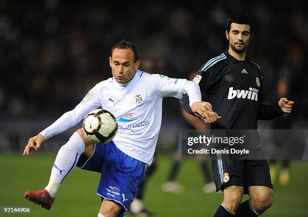 Nino of Tenerife controls the ball beside Raul Albiol of Real Madrid during the La Liga match between Tenerife and Real Madrid at the Heliodoro...