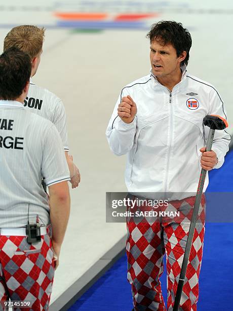 Norway's skip Thomas Ulsrud gives instructions to his teammates during their Vancouver Winter Olympics men's curling gold medal match against Canada...