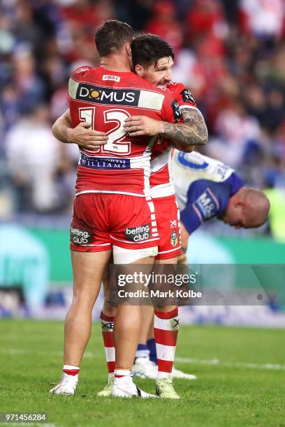 Tariq Sims and Gareth Widdop of the Dragons celebrate victory during the round 14 NRL match between the Canterbury Bulldogs and the St George...