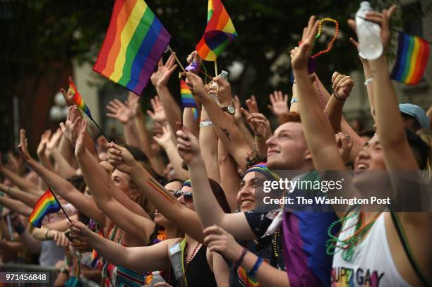 The Capital Pride parade moves along 17th Street in Washington, D.C., June 9, 2018. Thousands each year take to the streets of DC to show their...