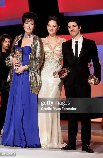 President of the ceremony actress Marion Cotillard congratulates Actress Isabelle Adjani for being awarded best Actress 2010 as Actor Tahar Rahim...