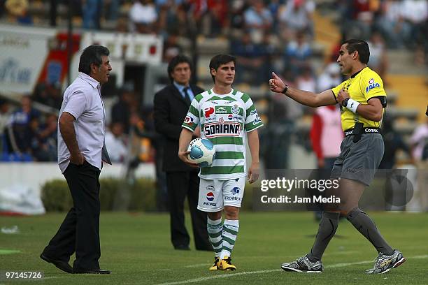 Queretaro's coach Carlos Reinoso , player Ivan Estrada of Santos and referee Marco Antonio Rodriguez during their match as part of 2010 Bicentenario...