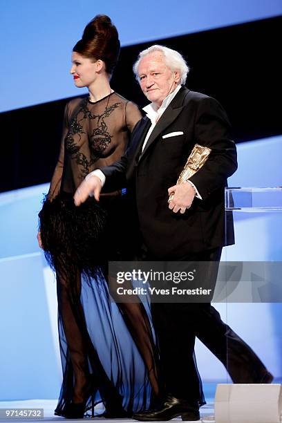 Laetitia Casta and Niels Arelstrup arrive onstage during the 35th Cesar Film Awards held at Theatre du Chatelet on February 27, 2010 in Paris, France.