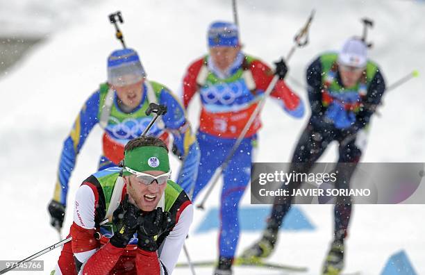 Austria's Eder Simon competes in the men's Biathlon 4 x 7.5 km relay at Whistler Olympic Park during the Vancouver Winter Olympics on February 26,...