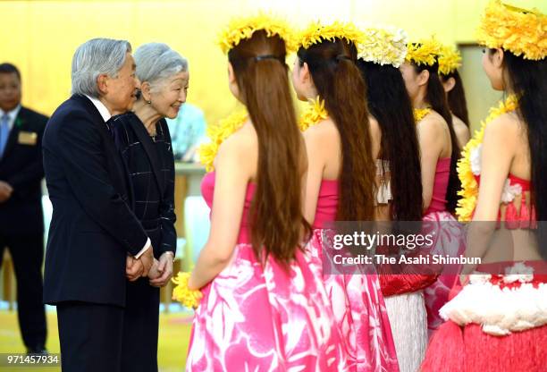 Emperor Akihito and Empress Michiko talk with hula girls at Spa Resort Hawaiians on June 9, 2018 in Iwaki, Fukushima, Japan. This 3-day trip could be...