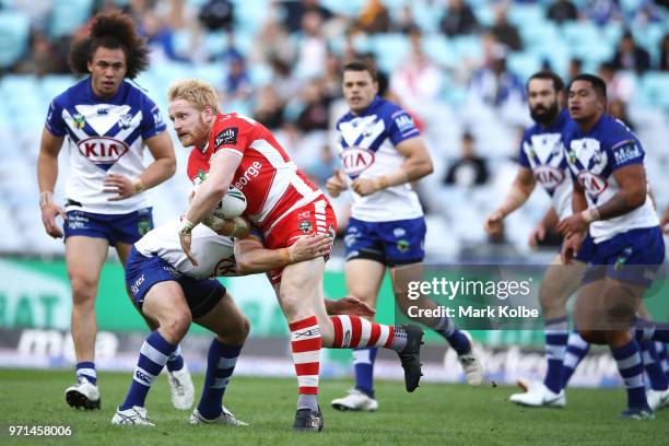 James Graham of the Dragons is tackled during the round 14 NRL match between the Canterbury Bulldogs and the St George Illawarra Dragons at ANZ...