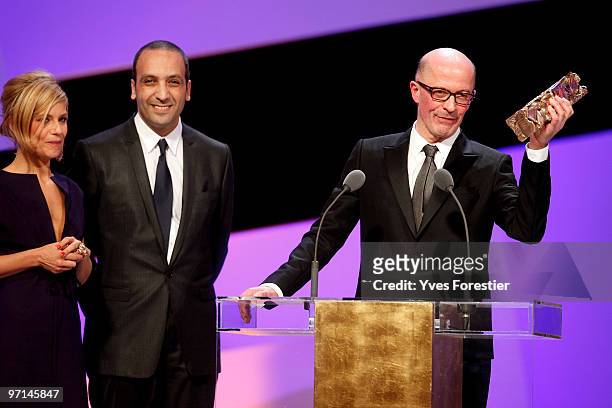 Actress Marina Fois, screenwriter Abdel raouf Dafri and director Jacques Audiard reacts onstage after he received Best Movie Cesar Award during the...