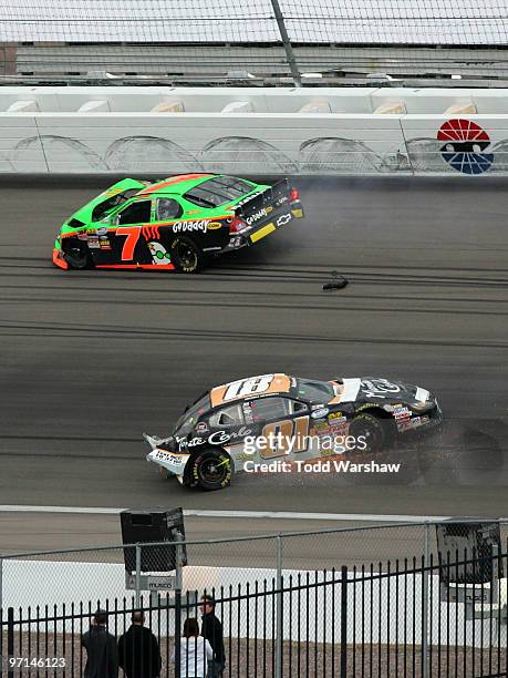 Danica Patrick, driver of the GoDaddy.com Chevrolet, and Michael McDowell, driver of the Monte Carlo Resort & Casino Dodge, spin after colliding...