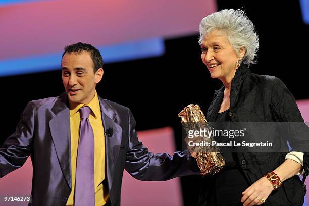 Catherine Leterrier reacts on stage after she received Best Costume Designer Award from Elie Semoun during the 35th Cesar Film Awards at the Theatre...