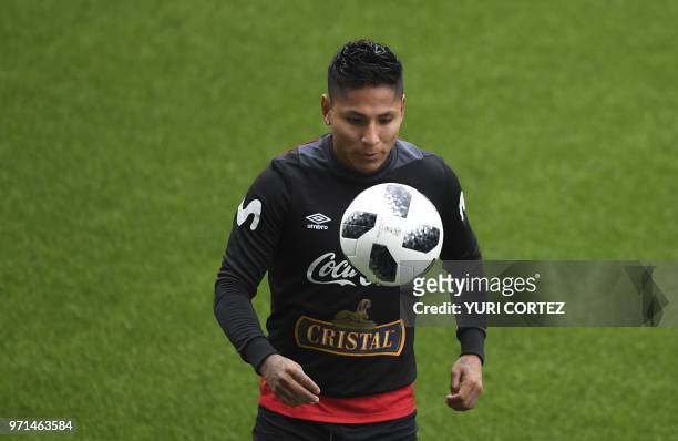 Peru's forward Raul Ruidiaz controls the ball during a training session at the Arena Khimki stadium, outside Moscow, on June 11 ahead of the Russia...