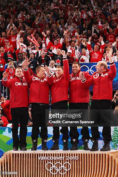 Adam Enright, Ben Hebert, Marc Kennedy, John Morris and Kevin Martin of Canada reacts with their gold medals after the Curling Men's Gold medal game...